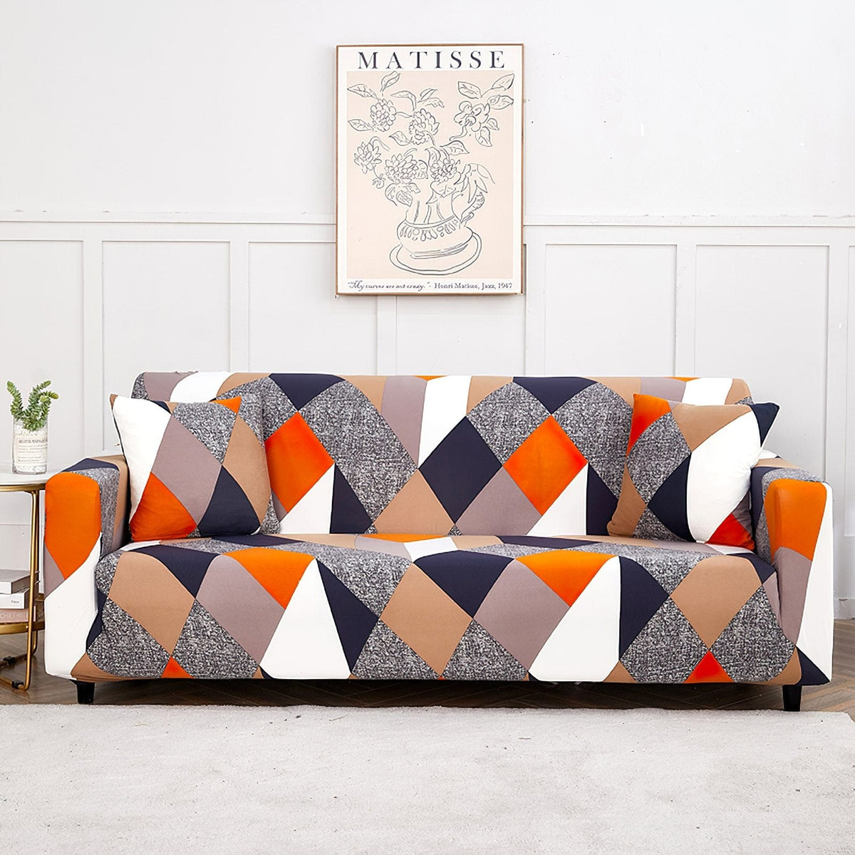 Funda de sofá elástica Patchwork naranja y marino