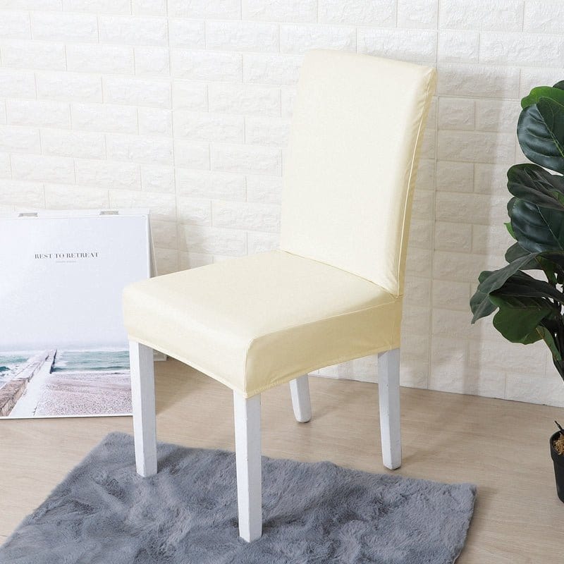 Funda de silla de comedor de polipiel, Marfil, colocada en una silla