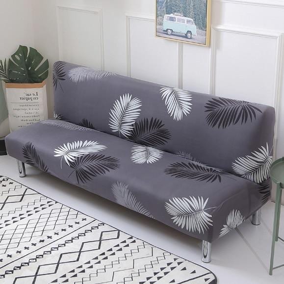 Funda de sofá cama clic clac elástica, Gris palmas, colocada en un sofá cama clic clac