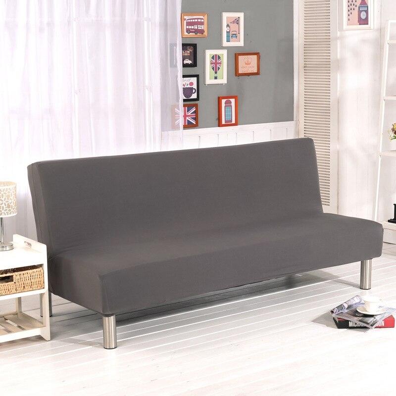 Funda de sofá cama clic clac elástica, Gris, colocada en un sofá cama clic clac