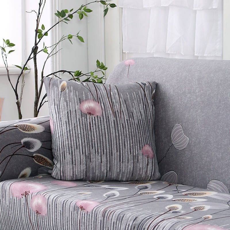 Fundas de cojín repelentes al agua 45 × 45 cm — pack de 2, Gris con pompones rosas, colocadas en un sofá