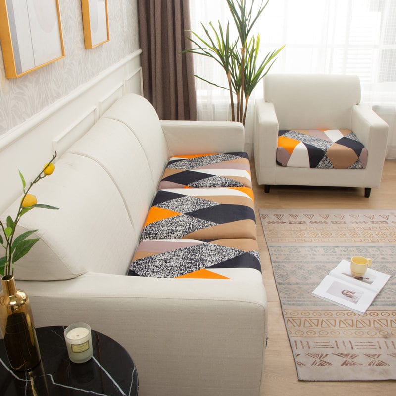 Funda de cojín de sofá elástica, Patchwork naranja y marino, colocada en los cojines de asiento y respaldo de un sofá